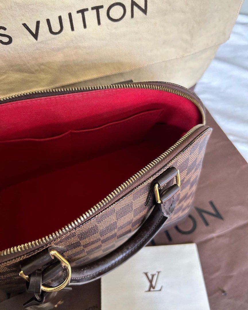 LOUIS VUITTON Alma PM Ebene Damier bag (Category: Luxury Bags & Wallets) located in Quezon City. Submitted by ohitsninja (Listing ID 1304635409, Image 3). Description: LOUIS VUITTON Alma PM Ebene Damier Inclusions: Certificate/Proof of Purchase, Original Dust Bag, Box, and Paper Bag As Seen in Photos Condition: Used Carefully, Minimal Scratches and Peeling Key holder has engraved initials DM for more details..