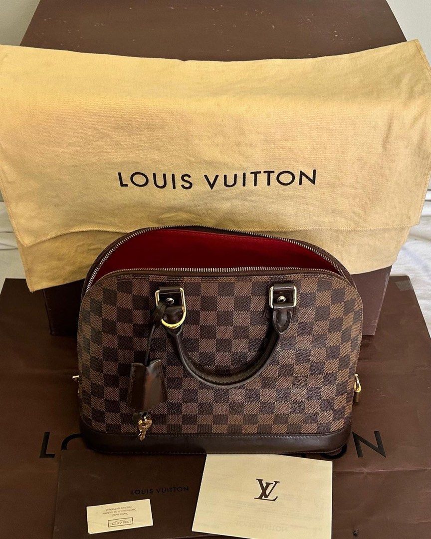 LOUIS VUITTON Alma PM Ebene Damier bag (Category: Luxury Bags & Wallets) located in Quezon City. Submitted by ohitsninja (Listing ID 1304635409, Image 2). Description: LOUIS VUITTON Alma PM Ebene Damier Inclusions: Certificate/Proof of Purchase, Original Dust Bag, Box, and Paper Bag As Seen in Photos Condition: Used Carefully, Minimal Scratches and Peeling Key holder has engraved initials DM for more details..