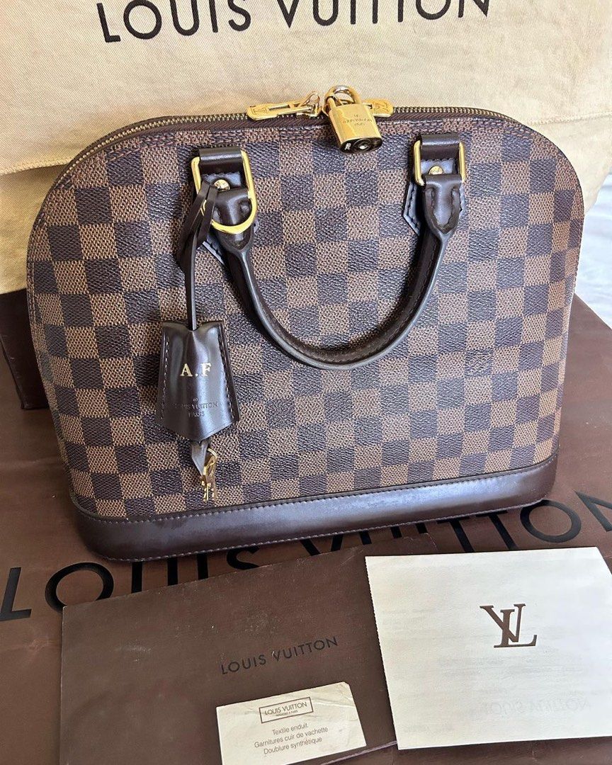 LOUIS VUITTON Alma PM Ebene Damier bag (Category: Luxury Bags & Wallets) located in Quezon City. Submitted by ohitsninja (Listing ID 1304635409, Image 1). Description: LOUIS VUITTON Alma PM Ebene Damier Inclusions: Certificate/Proof of Purchase, Original Dust Bag, Box, and Paper Bag As Seen in Photos Condition: Used Carefully, Minimal Scratches and Peeling Key holder has engraved initials DM for more details..