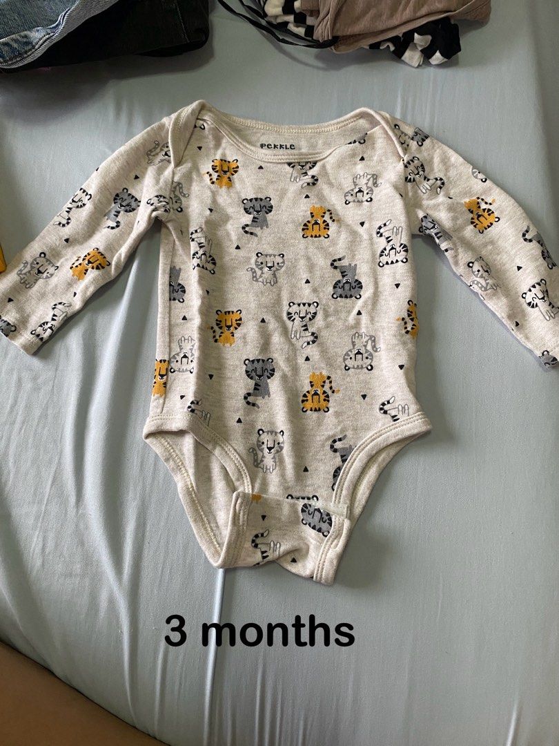 Newborn onesie (Category: Babies & Kids Fashion) located in Las Pinas. Submitted by ketshops (Listing ID 1304616429, Image 2). Description: 80 pesos each. In really good condition. Sizes are indicated below each photo.