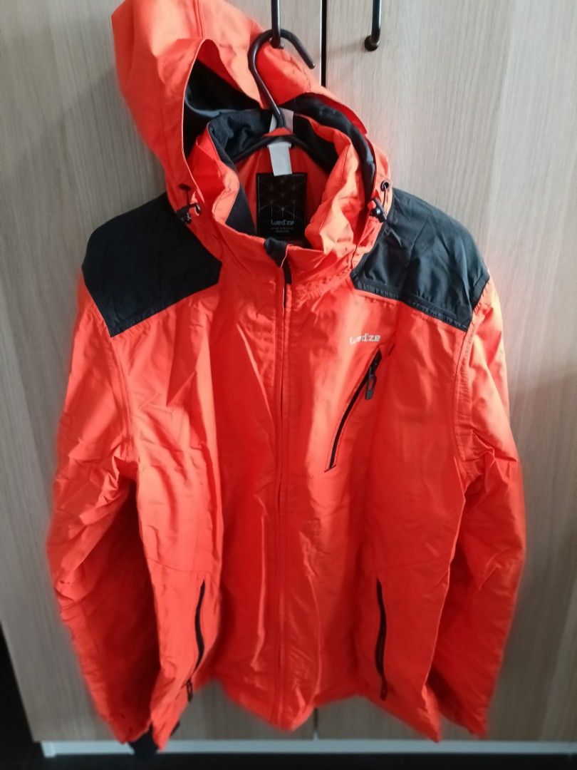 Winter Jacket (Category: Coats, Jackets and Outerwear) located in Singapore. Submitted by liwenchen84 (Listing ID 1304663289, Image 1). Description: Bright orange ski jacket with black lining comes with lots of pockets and straps for adjustments.