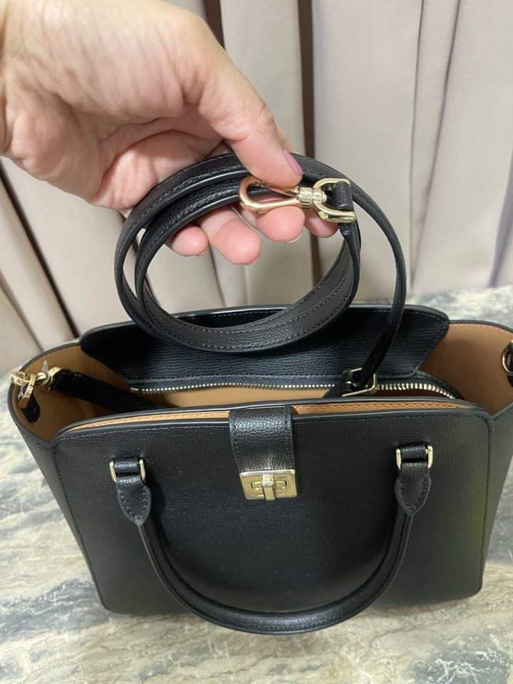 Kate Spade Phoebe Satchel (Category: Luxury Bags & Wallets) located in San Pedro. Submitted by misslumi (Listing ID 1304850479, Image 2). Description: BRAND NEW and 💯 original from US! Can be worn as crossbody bag or hand bag. Medium size - perfect for everyday use. COLOR: Black MATERIALS: Refined Grain Leather SIZE: 4.72″ W x 8.58″ H x 10.67″ D Strap Drop: 22″ Metal Pinmount LogoClosure Type: turn lock closure Exterior: front slip pocket Strap 