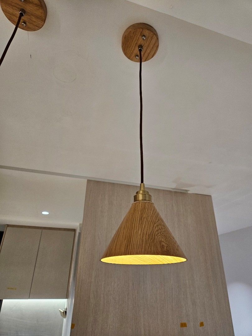 Scandinavian Wooden Lamp Shade Pendant Light (Category: Lighting) located in Singapore. Submitted by gotohaveit (Listing ID 1304882347, Image 3). Description: bought this pendant light in light brown color. new and was trying it on our new house. however we wanted a change to full black lighting instead. hence selling this away. Will come with bulbs. selling 3 lighting together each at 50 dollar. online is selling it at 230.