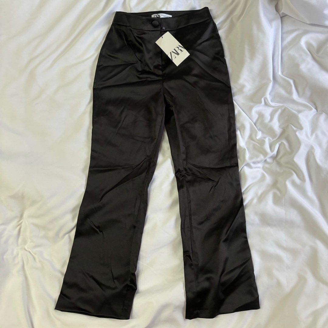 Zara Satin Flare Black Trousers (Category: Other Bottoms) located in Manila. Submitted by shop.declutter (Listing ID 1304814919, Image 1). Description: Xs on tag Fits waist size 25-26.