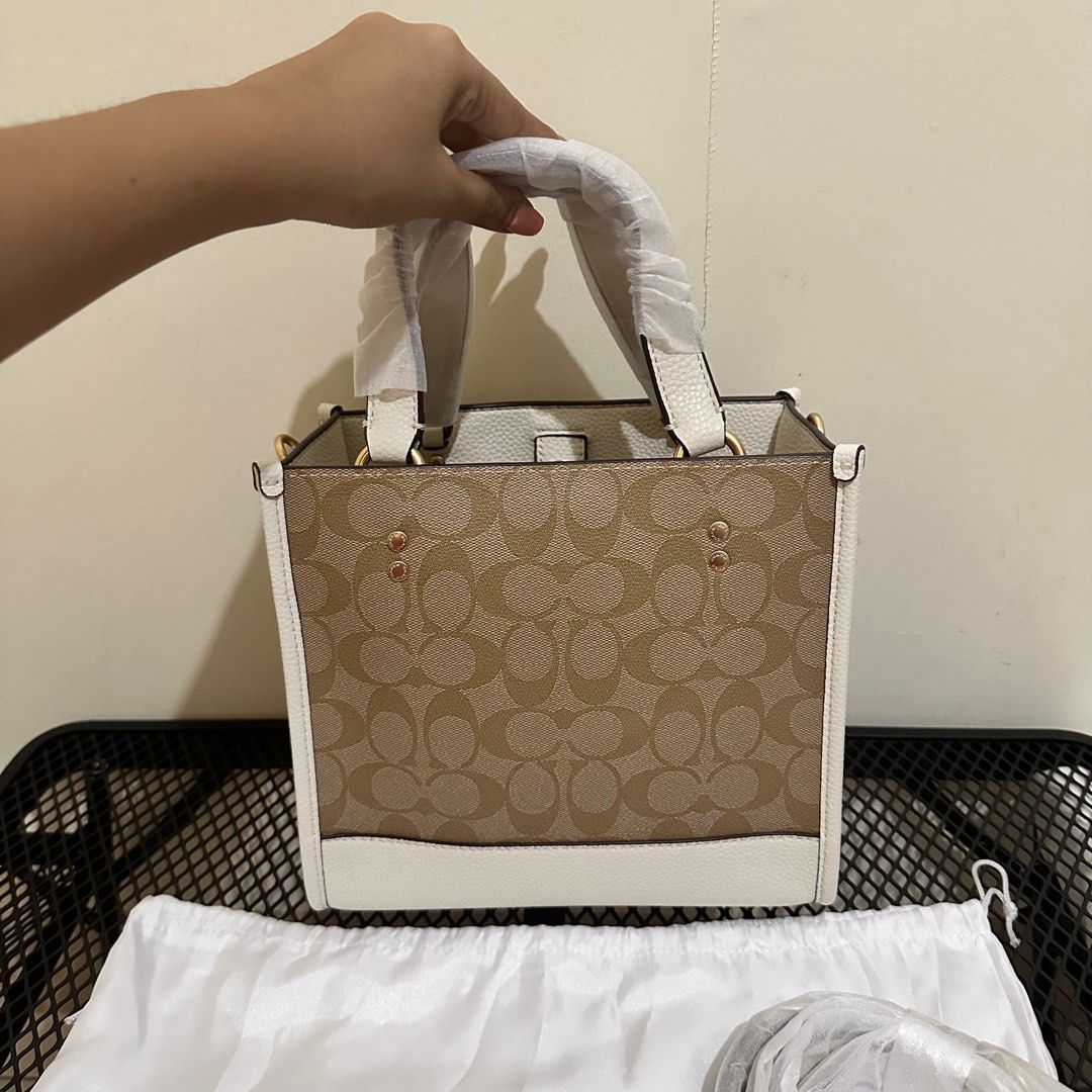 Coach Dempsey Tote Signature (Category: Luxury Bags & Wallets) located in Makati City. Submitted by lux.mariah (Listing ID 1305057619, Image 3). Description: 💯 Guaranteed authentic 2 way bag Brand new Complete Inclusions Courier: J&t /Lalamove/ LBC Mop: Gcash / Bank Transfer/ Maya.