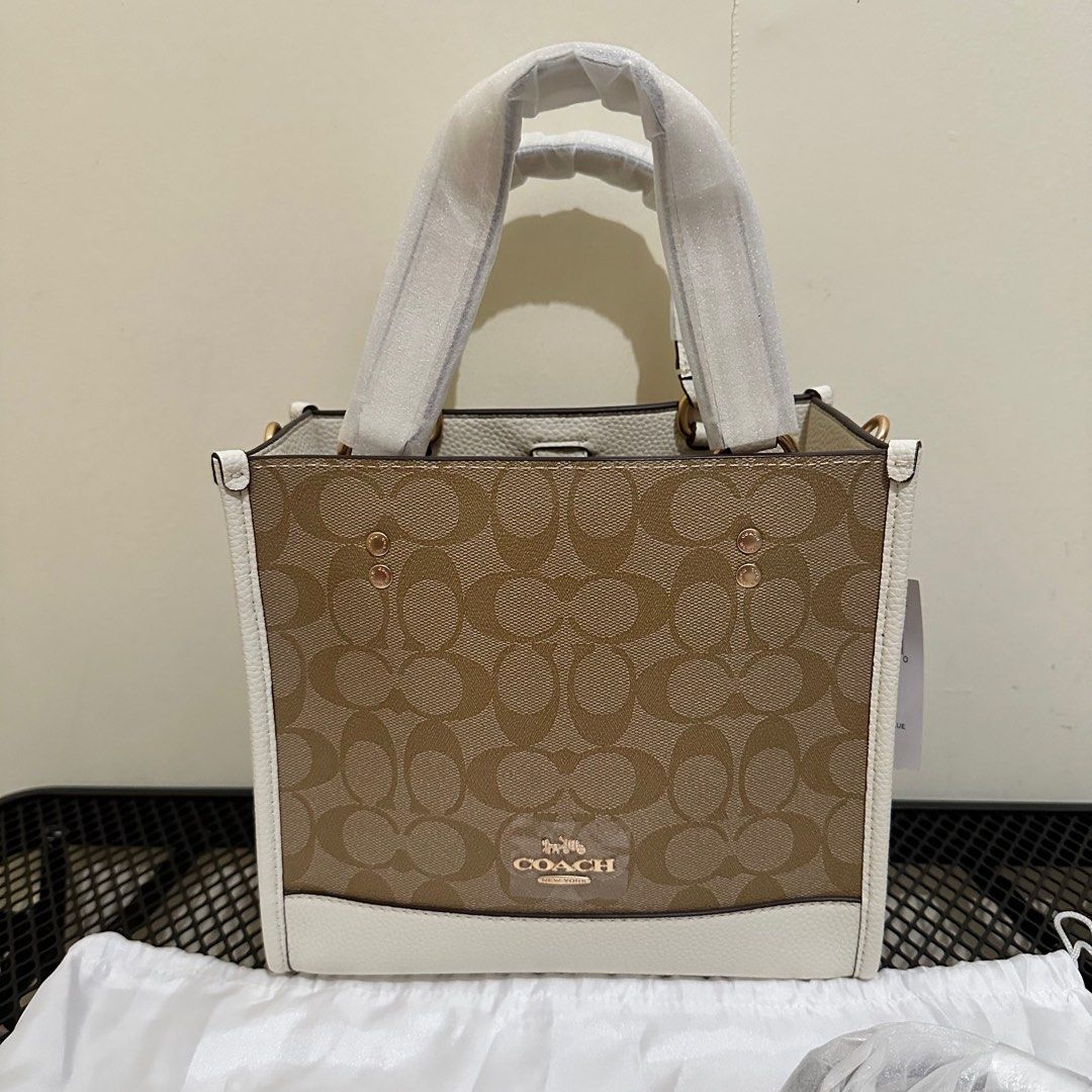 Coach Dempsey Tote Signature (Category: Luxury Bags & Wallets) located in Makati City. Submitted by lux.mariah (Listing ID 1305057619, Image 2). Description: 💯 Guaranteed authentic 2 way bag Brand new Complete Inclusions Courier: J&t /Lalamove/ LBC Mop: Gcash / Bank Transfer/ Maya.