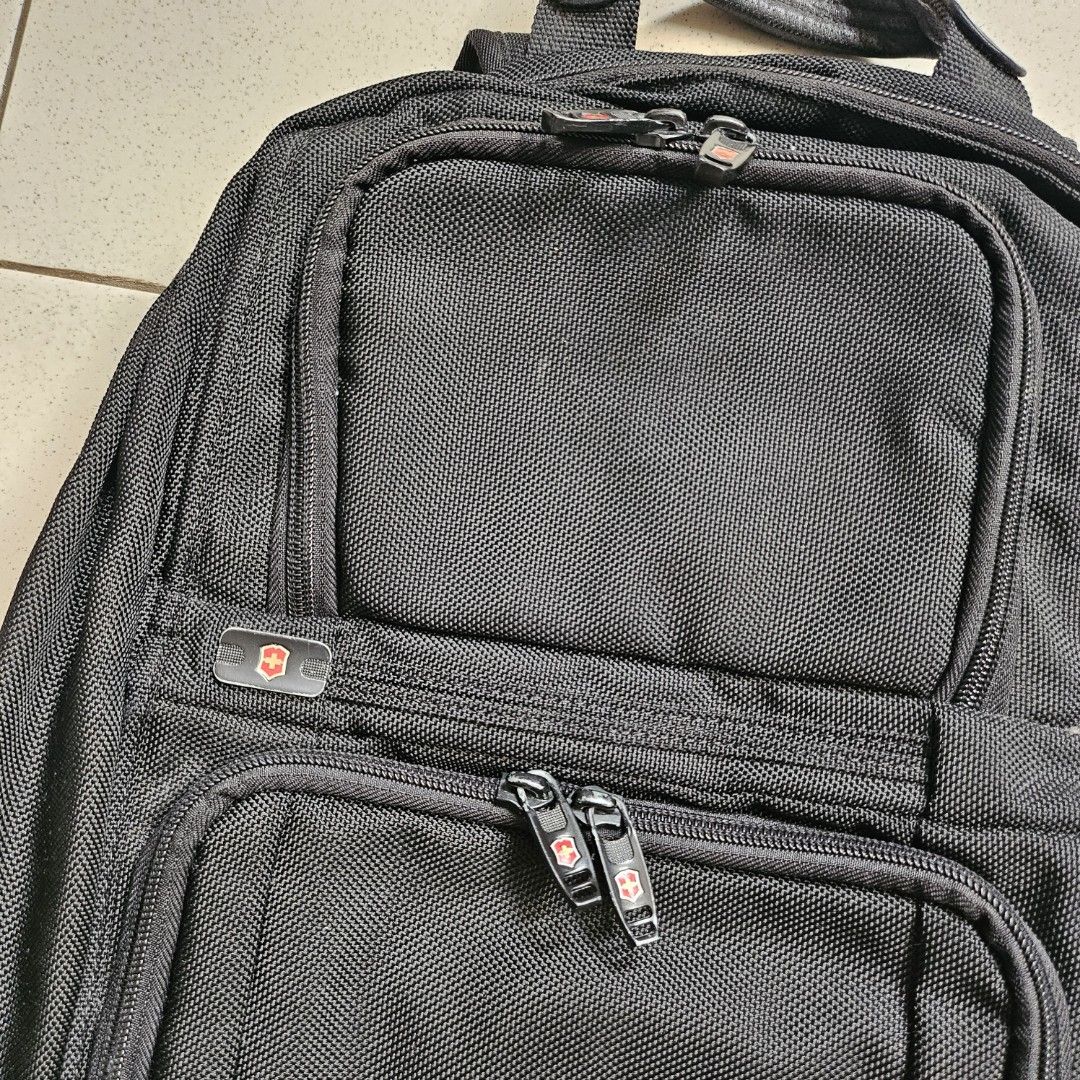 original Victorinox black laptop backpack bag (Category: Backpacks) located in Muntinlupa City. Submitted by .mrrssllzr (Listing ID 1305067920, Image 2). Description: flaws: - minimal signs of use - see photo of top main zippers - minor stains inside but does not look too awful, not sure if can be washed but i believe yes see last photo for measurements when laid flat.