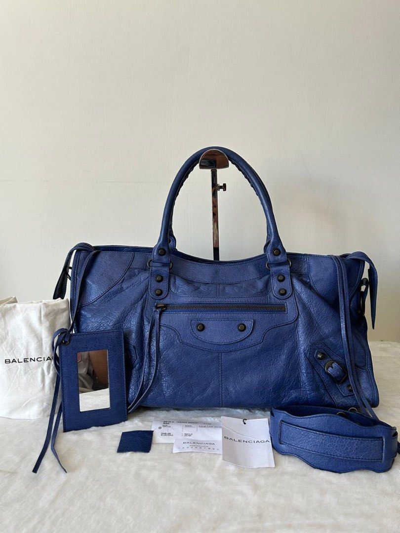 Part time 2- way Bag (Category: Luxury Bags & Wallets) located in Manila. Submitted by bagislifeshop (Listing ID 1305104828, Image 1). Description: ☑️Available in Pampanga ✅Condition: 8.8/10 ✅Colour: Blue ✅Materila: Lambskin ✅Size: 17” L x 6.5” W x 9 “H ✅Inclusions: Dustbag, mirror and long strap .