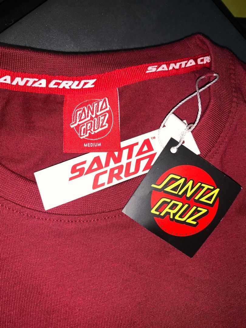 Santa Cruz T-Shirt (Category: Tshirts & Polo Shirts ) located in Manila. Submitted by simoneehain (Listing ID 1305074870, Image 1). Description: Authentic Santa Cruz Regular Fit T-Shirt in excellent condition. Featuring the screaming hand design, this burgundy t-shirt is made from 100% cotton and is perfect for casual wear. Originally purchased for ₱1,339.99, now selling for ₱700 only. Brand: Santa Cruz Style: Men's Regular Fit T-Shirt Size: Medi