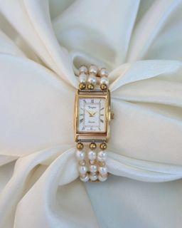Tempus tank style w/ fresh water pearls on its band vintage watch