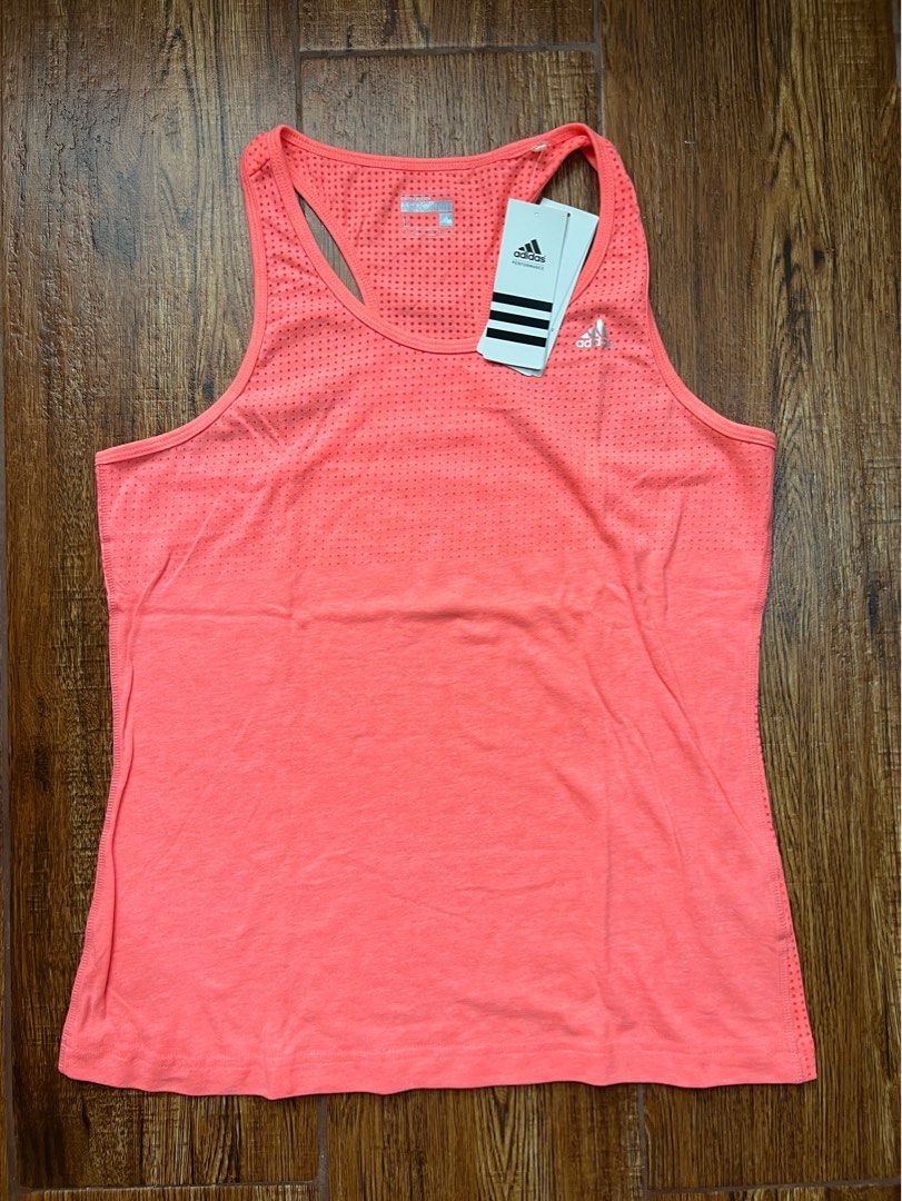 ADIDAS - Climacool Aeroknit Top - L (Category: Activewear) located in Manila. Submitted by offthenest (Listing ID 1305146986, Image 1). Description: Brand: Adidas Type: Tank Top Colorway: Salmon Peach Size: L Condition: Brand New with Tags SRP: P1,395.00 RFS: Decluttering MOP: BPI / BDO / GCASH NO SWAPS #adidas #womens #tanktop #running .