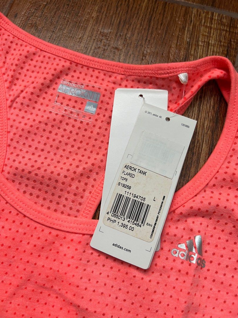 ADIDAS - Climacool Aeroknit Top - L (Category: Activewear) located in Manila. Submitted by offthenest (Listing ID 1305146986, Image 3). Description: Brand: Adidas Type: Tank Top Colorway: Salmon Peach Size: L Condition: Brand New with Tags SRP: P1,395.00 RFS: Decluttering MOP: BPI / BDO / GCASH NO SWAPS #adidas #womens #tanktop #running .