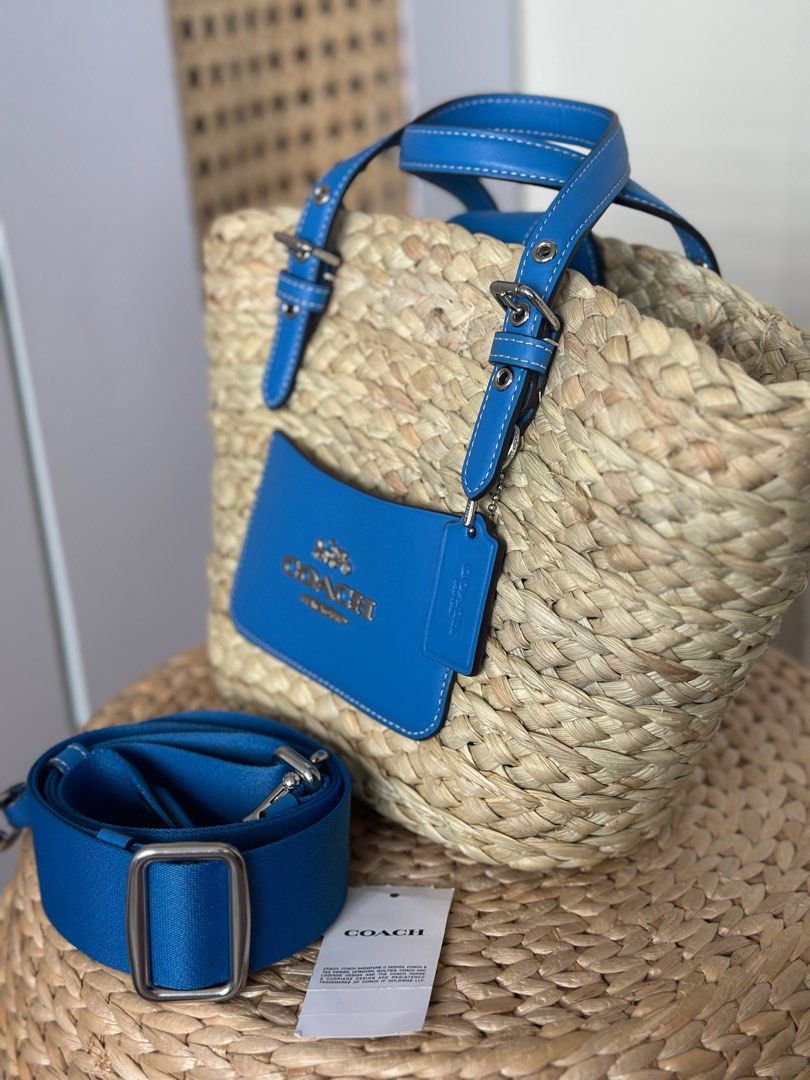 Coach Small Straw Tote Blue (Category: Luxury Bags & Wallets) located in Manila. Submitted by gracemcd2024 (Listing ID 1305149528, Image 2). Description: Brand New bought Jan 2024 in Singapore with strap and dustbag.
