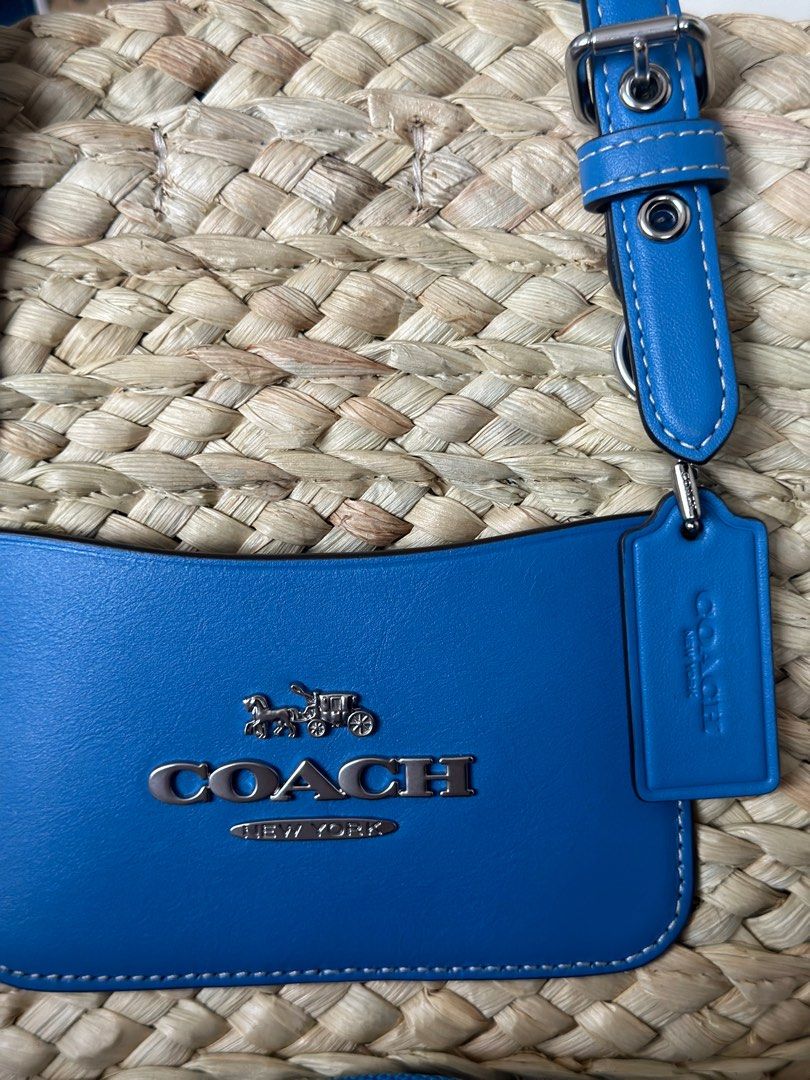 Coach Small Straw Tote Blue (Category: Luxury Bags & Wallets) located in Manila. Submitted by gracemcd2024 (Listing ID 1305149528, Image 3). Description: Brand New bought Jan 2024 in Singapore with strap and dustbag.