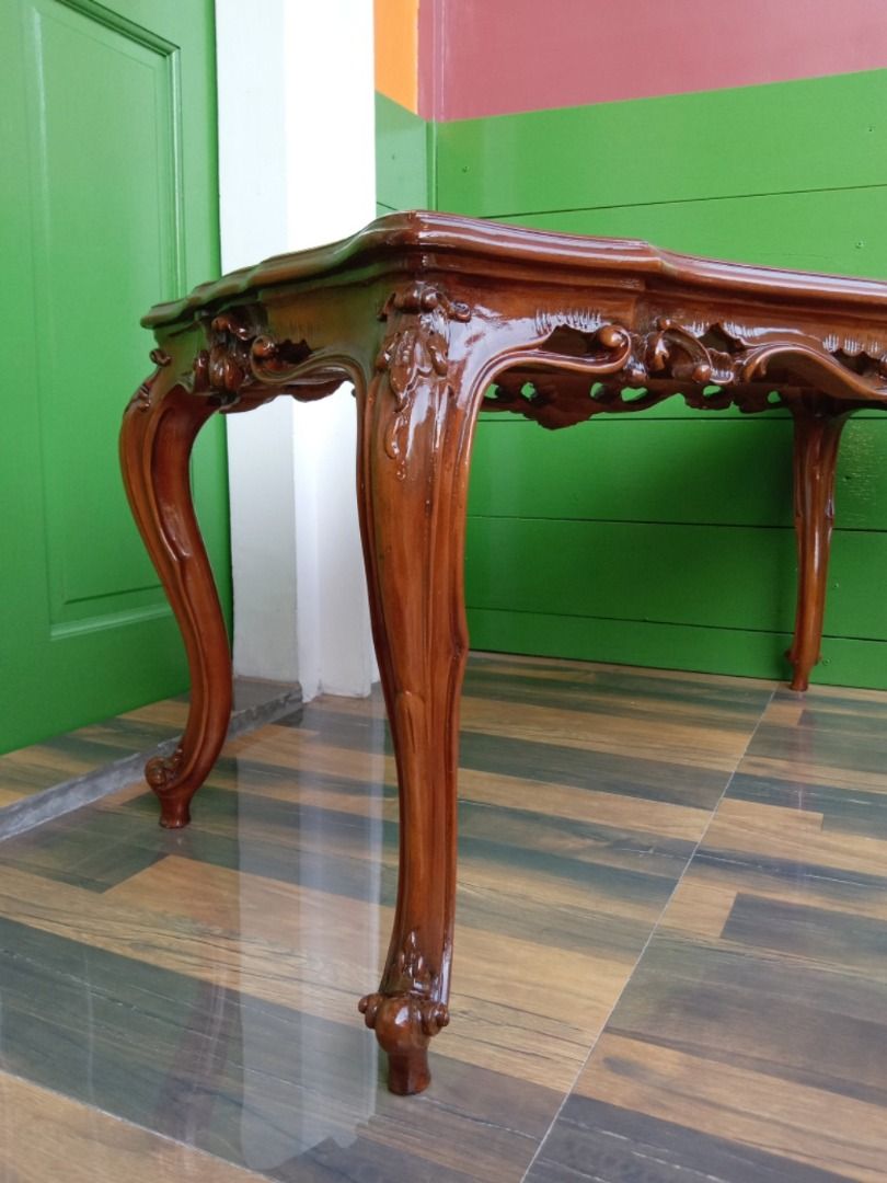 French Walnut Wooden Coffee Center Table (Category: Tables & Sets) located in Dasmarinas. Submitted by jamricana137 (Listing ID 1305168490, Image 2). Description: French Walnut Wooden Coffee Center Table in the Style of Louis XV. This table was delicately carved, and is raised on four carved cabriole legs. Completely restored, very sturdy and in great condition. Dimensions: L98 x W49 x H49cm.