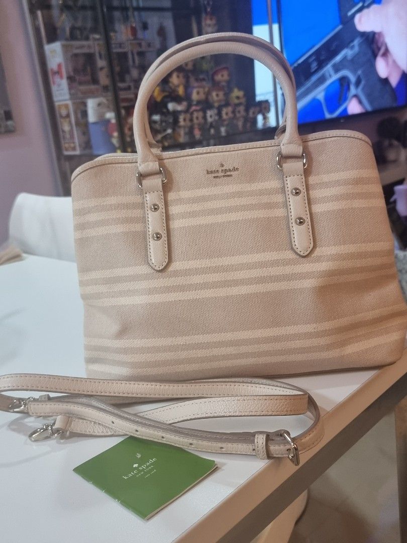 Kate Spade New York Hand/Sling Bag (Category: Luxury Bags & Wallets) located in Cavite. Submitted by lhej22 (Listing ID 1305229917, Image 3). Description: Kate Spade New York Top Handle Bag 💯%Original Good as new Neutrals Canvas Graphic Print Gold-Tone Hardware Leather Trim Rolled Handles Leather Trim Embellishment Jacquard Lining & Four Interior Pockets Snap Closure at Top Protective Feet at Base.