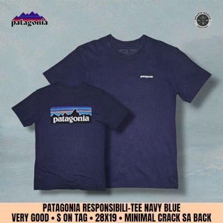 PATAGONIA RESPONSIBILI-TEE 
NAVY BLUE 
VERY GOOD 
SMALL ON TAG 
FITS MEDIUM 
28X19
MINIMAL CRACK SA BACK PRINT 
WASHED: RTW
550+SF