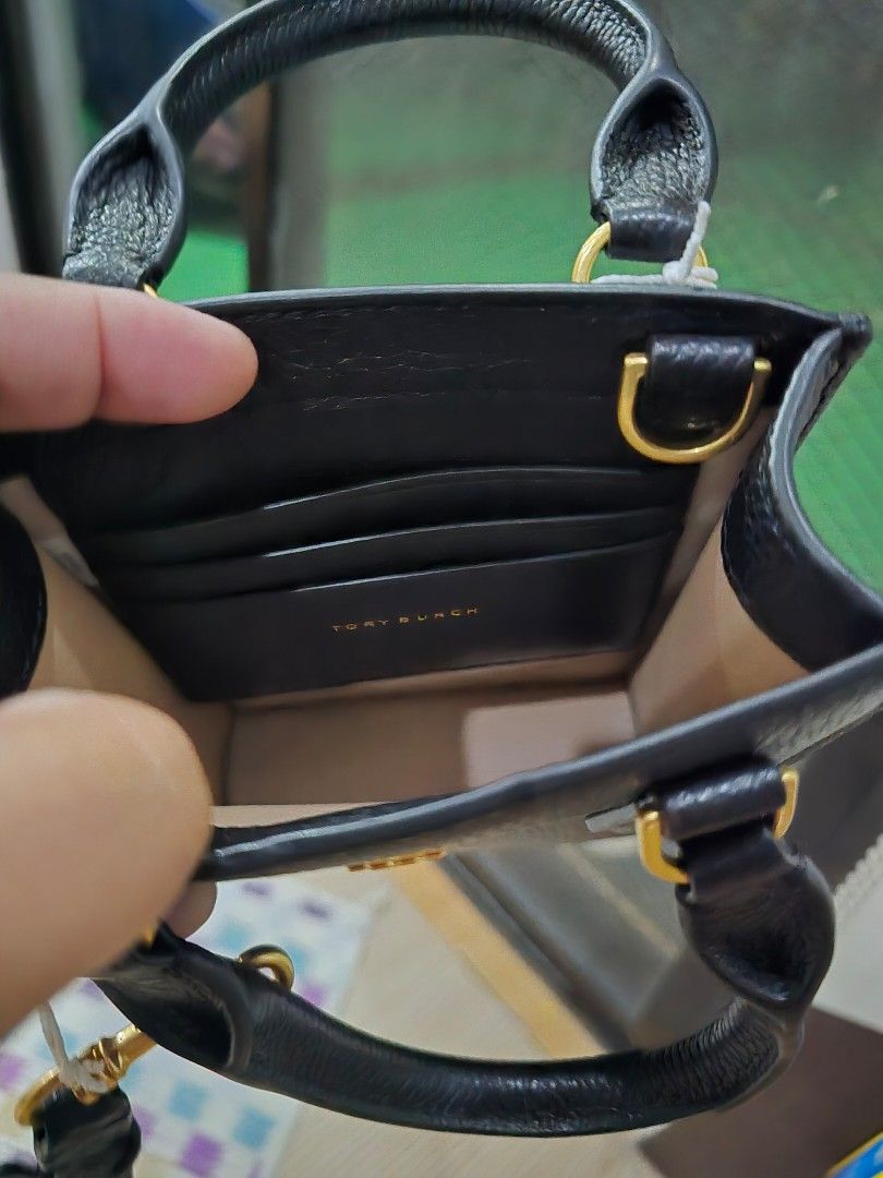 Tory Burch Blake Mini Shopper (Category: Luxury Bags & Wallets) located in San Pedro. Submitted by misslumi (Listing ID 1305256291, Image 3). Description: LAST PRICE POSTED! Tory Burch Blake Mini Shopper Brand new from US! Includes: tags, polyplastic, gift receipt No paper bag Saktong sakto lang iphone 14 pro max pero nuch better sa smaller phones para di ganun ka-kita..