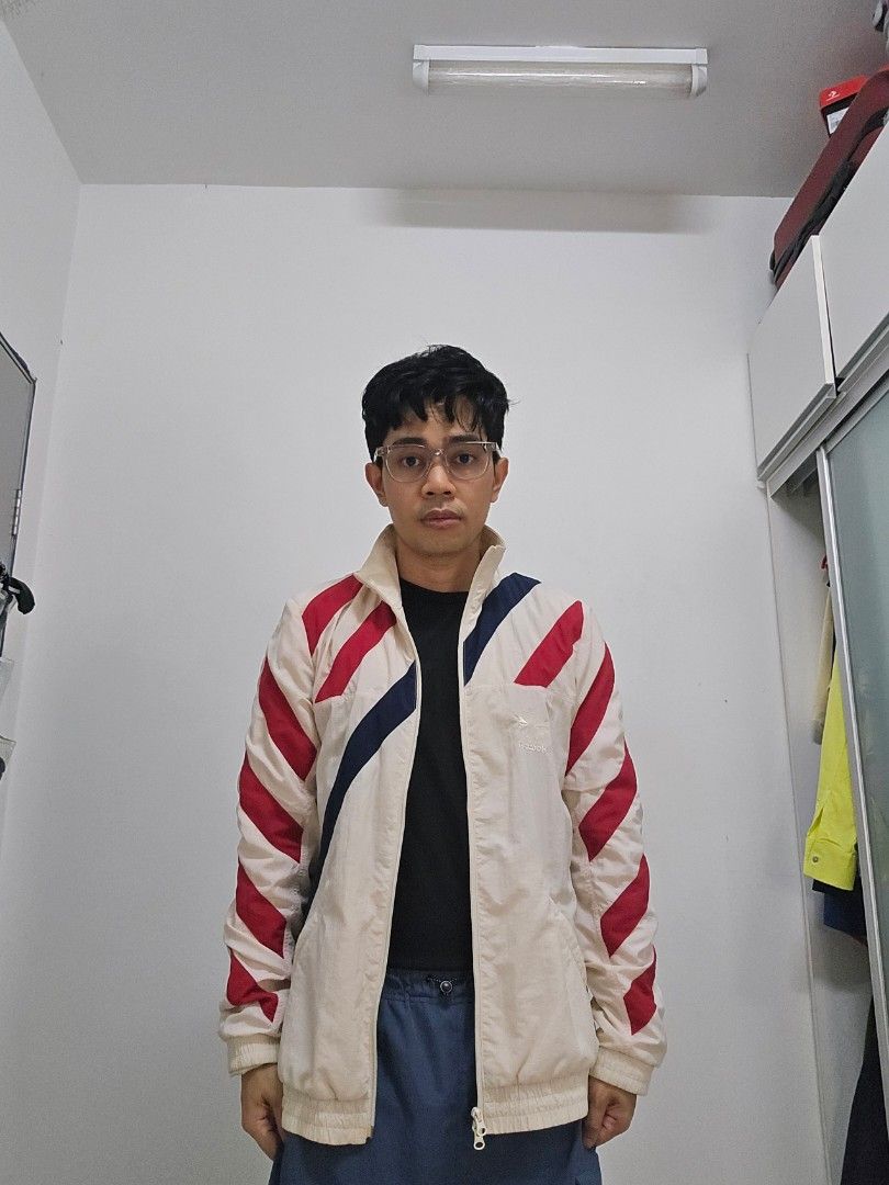 Training Jacket (Category: Activewear) located in Cyberjaya. Submitted by wizardio (Listing ID 1305164357, Image 2). Description: off white color with stripes red and navy.