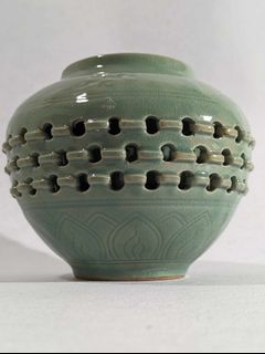 Korean, celadon vase with a double wall basket weave decoration.