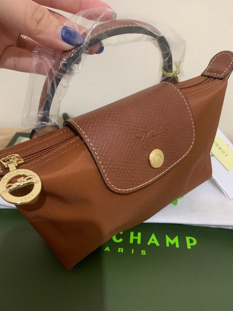 Longchamp mini authentic with strap (Category: Luxury Bags & Wallets) located in Cabuyao City. Submitted by luxbymishy (Listing ID 1305474114, Image 2). Description: 3500 no sling 4500 with sling.