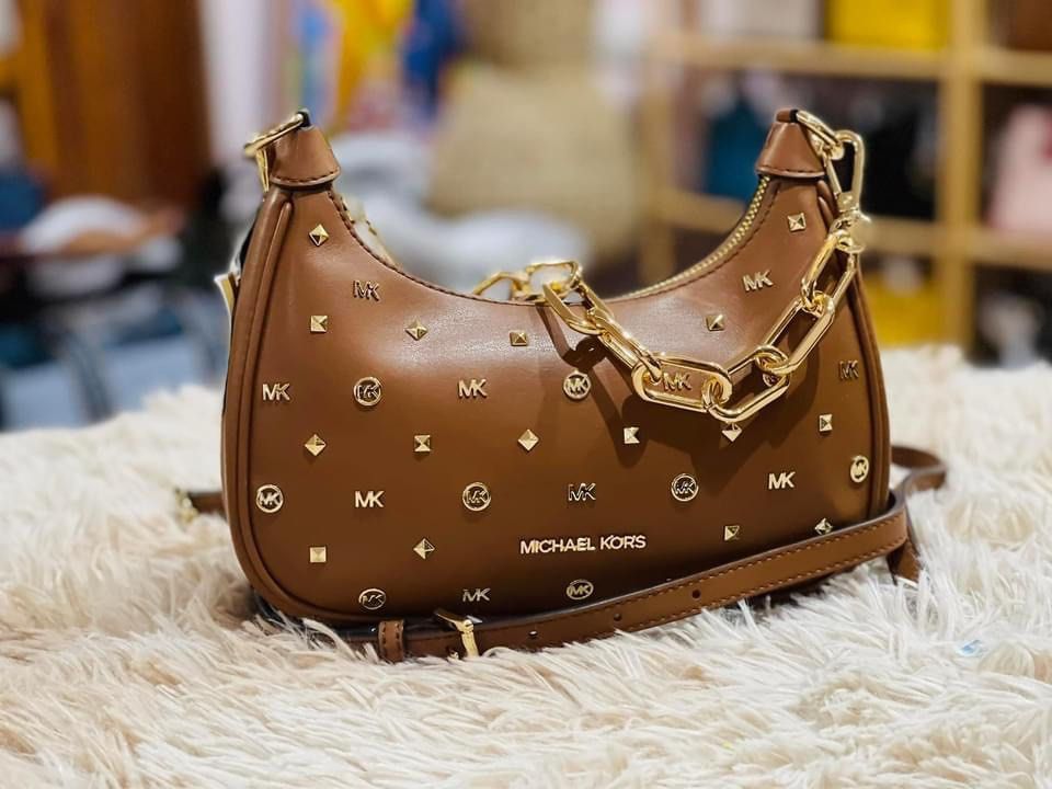 💯ORIGINAL MICHAEL KORS CORA STUDDED BROWN medium (Category: Luxury Bags & Wallets) located in Quezon City. Submitted by ashongsstore (Listing ID 1305360532, Image 1). Description: 🇵🇭AVAILABLE🇵🇭 ‼️Please look at our pictures as that is exactly what you are purchasing‼️ 10000% Original Not REPLICA, OEM, TOP GRADE QUALITY, AUTHENTIC QUALITY or Any other Terms to DENOTE FAKE! 😎 . Guaranteed ORIGINAL AND BRANDNEW or TRIPLE your MONEY BACK if pro