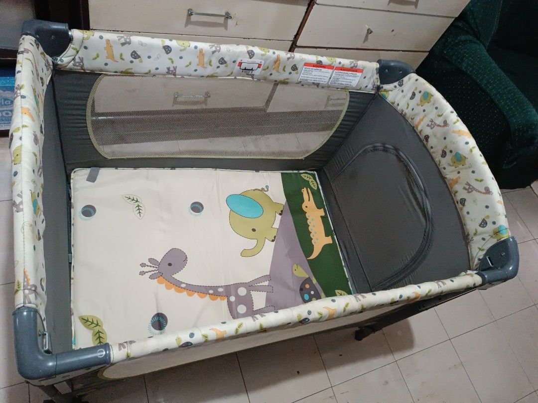 Preloved Full set Crib (Category: Cots & Cribs) located in Manila. Submitted by shoptrinketscloset (Listing ID 1305324438, Image 3). Description: Full set Crib See photos Since this is a preloved item,expect signs of usage with small holes in the net NOTE: Incomplete Diaper stacker (Missing one basket) All complete Play yard with full bassinet Diaper changing Mat One hand locking mechanism Insect Net to keep your child away from insects Mobile wi