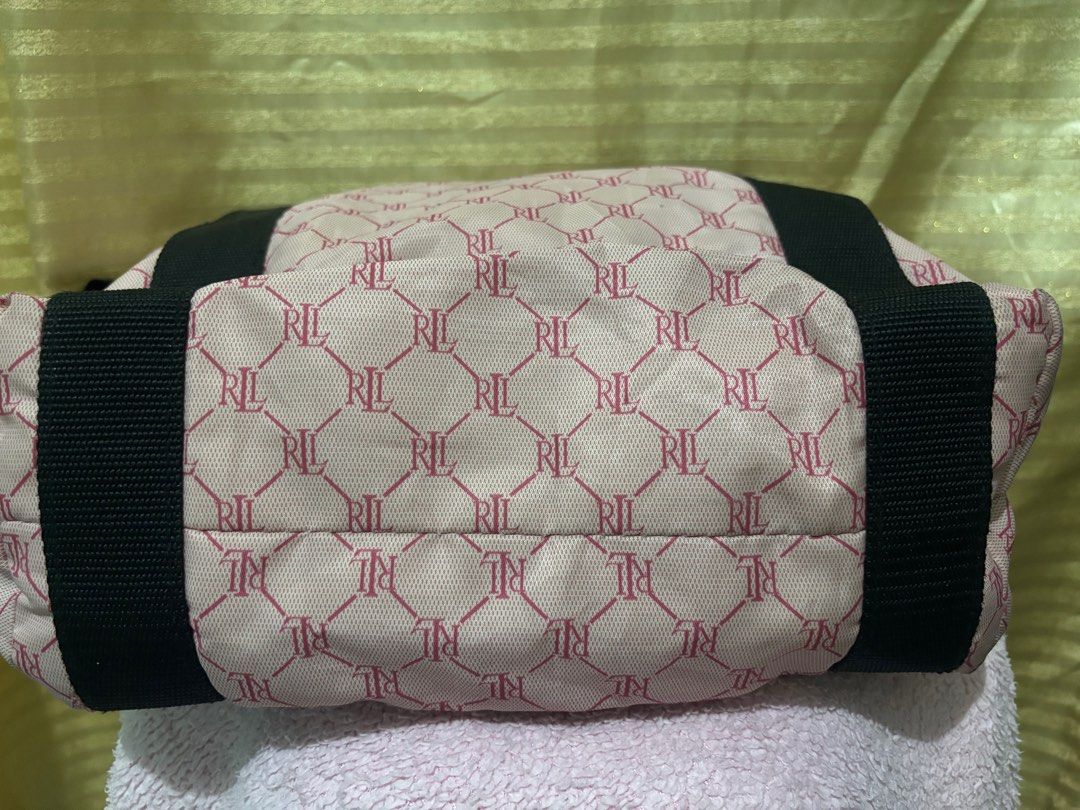 RALPH LAUREN NYLON TOTE BAG (Category: Luxury Bags & Wallets) located in San Fernando. Submitted by adadp24 (Listing ID 1305434529, Image 3). Description: RFS Decluttering Size 15x12 inches Nylon material in perfect condition, even the inner lining. No rubs no cracks Issue super small blackish stain at the back unnoticeable unless titigan Baka matanggal sa laba, kayo napo maglaba Very small tarnish sa front hardware pero super silver pa ang color