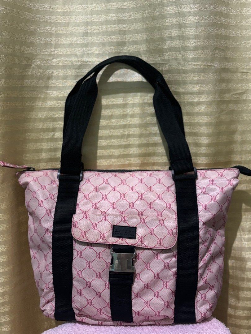 RALPH LAUREN NYLON TOTE BAG (Category: Luxury Bags & Wallets) located in San Fernando. Submitted by adadp24 (Listing ID 1305434529, Image 1). Description: RFS Decluttering Size 15x12 inches Nylon material in perfect condition, even the inner lining. No rubs no cracks Issue super small blackish stain at the back unnoticeable unless titigan Baka matanggal sa laba, kayo napo maglaba Very small tarnish sa front hardware pero super silver pa ang color