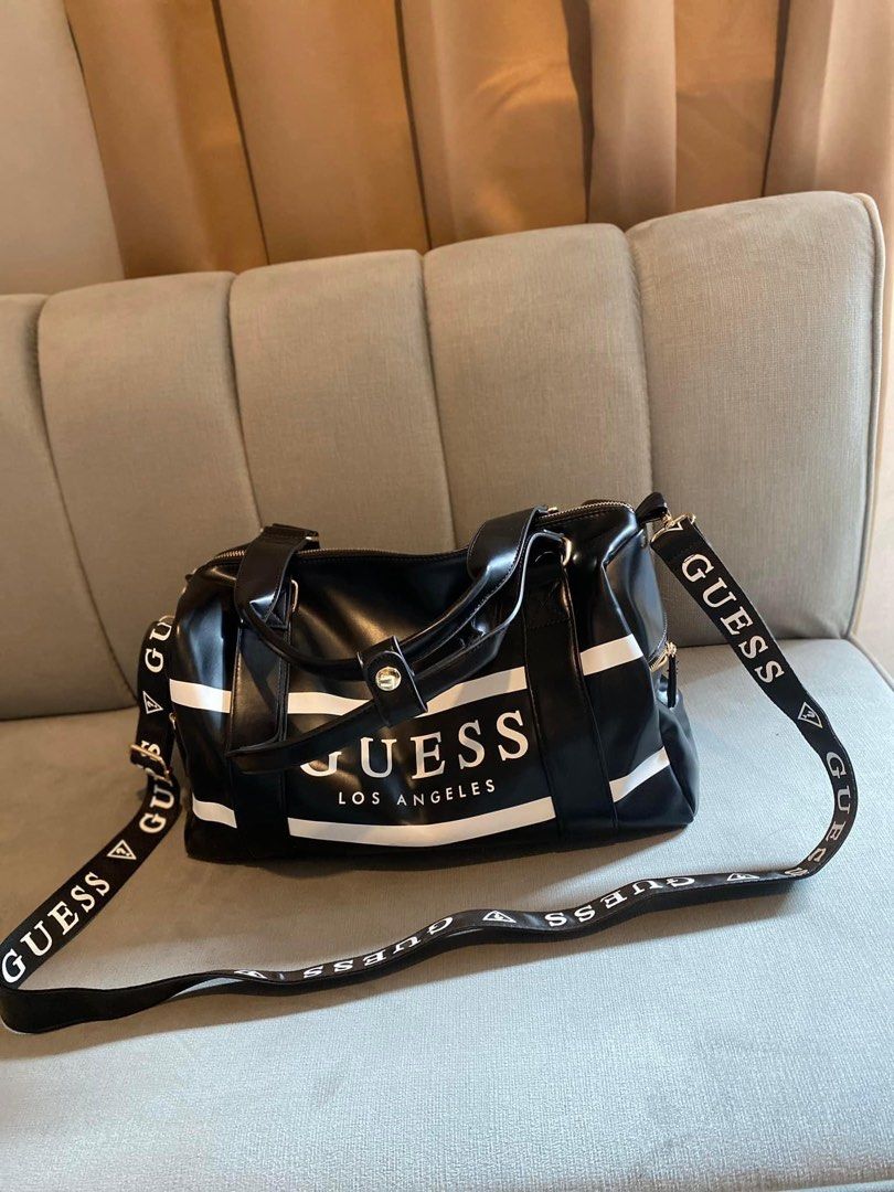 Travel bag (Category: Luxury Bags & Wallets) located in Valenzuela. Submitted by smjhsmnlzcn (Listing ID 1305326599, Image 2). Description: Best SELLER! Guess travel bag with sling strap Limited stocks only. Available 2 colors Onhand ready to ship/deliver.