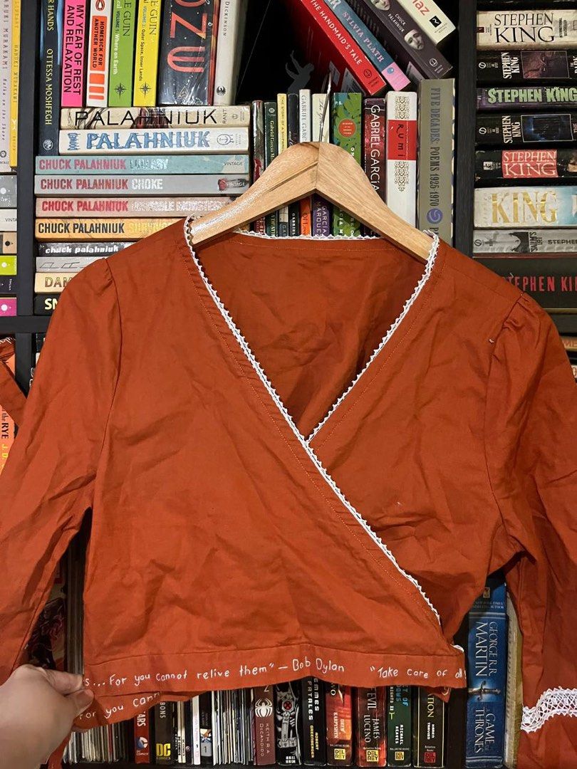 Bob Dylan Embroidered Wrap Bell Sleeved Top (Category: Blouses) located in Mandaluyong City. Submitted by hopeworldplane (Listing ID 1305551494, Image 1). Description: Super nice bell sleeved orange wrap top with Bob Dylan lyrics embroidered on the tie part. fits S-L RFS: too big for me :( .