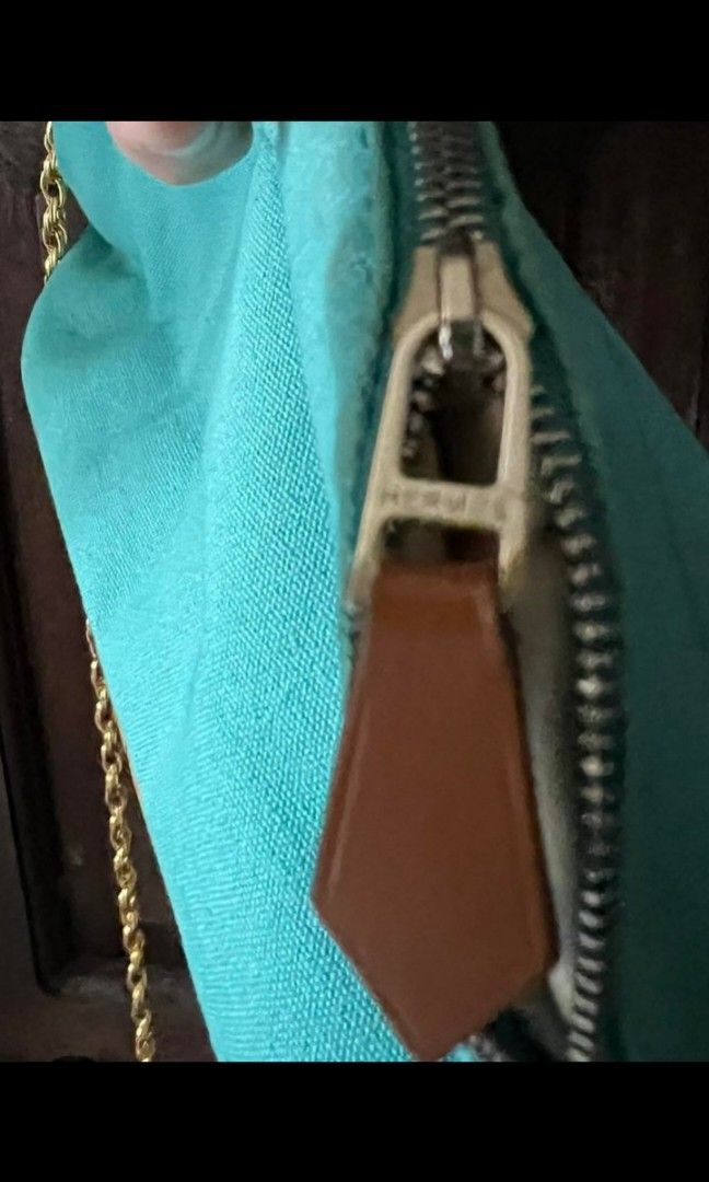 HERMES Pouch (Category: Luxury Bags & Wallets) located in Quezon City. Submitted by uptrendglam (Listing ID 1305606247, Image 3). Description: Hermes pouch, ive provided it with a gold sling to create the slingbag look. Small in size, but can fit your phone. Guaranteed authentic. Made in France and 100% cotton. Never worn. Issue : needs wash.