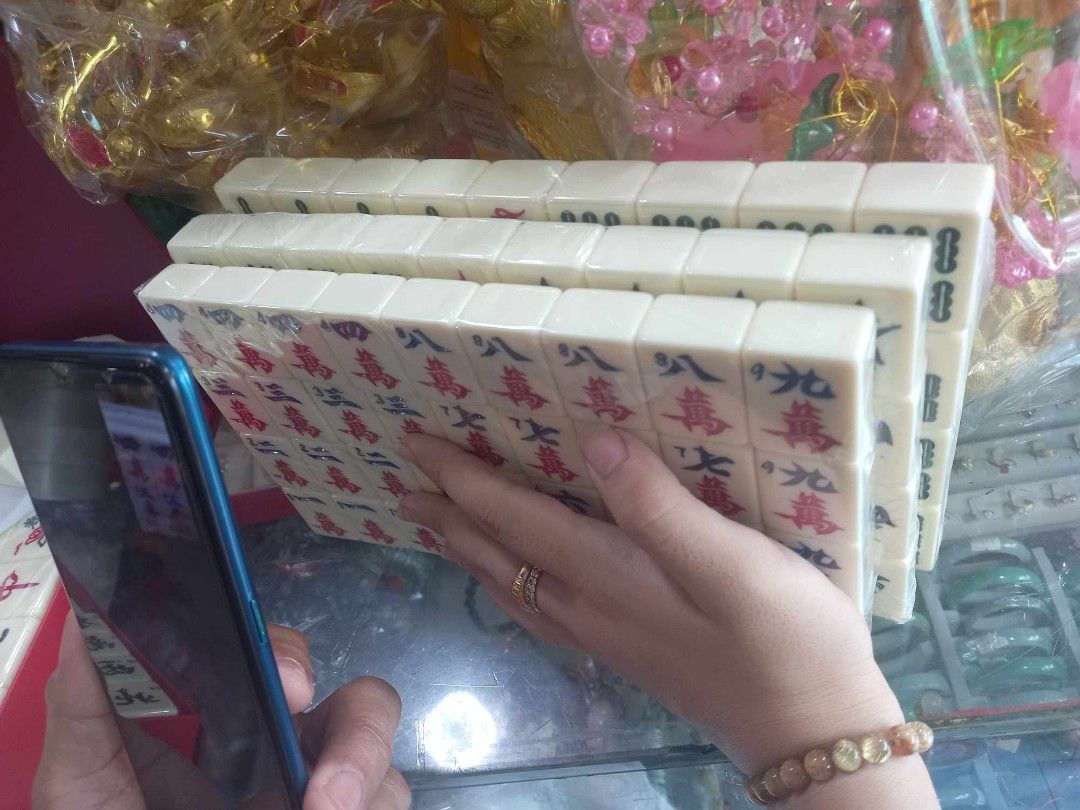 Mahjong set (Price Varies on sizes available) (Category: Board Games & Puzzles) located in Manila. Submitted by julieggggg (Listing ID 1305532007, Image 1). Description: 144 tiles in one set with 2 extra blank tiles with 2 dice and one marker color available: ivory, blue, green or pink Mahjong set price list: Travelling size 1250 pesos Señorita 1350 pesos Standard/ Regular size 35mm 1400 pesos Jumbo 36mm1800 pesos Super Jumbo 38mm 2300 pesos Xtra