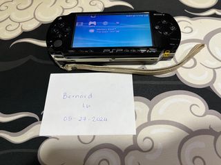PSP 1000 with UMDs