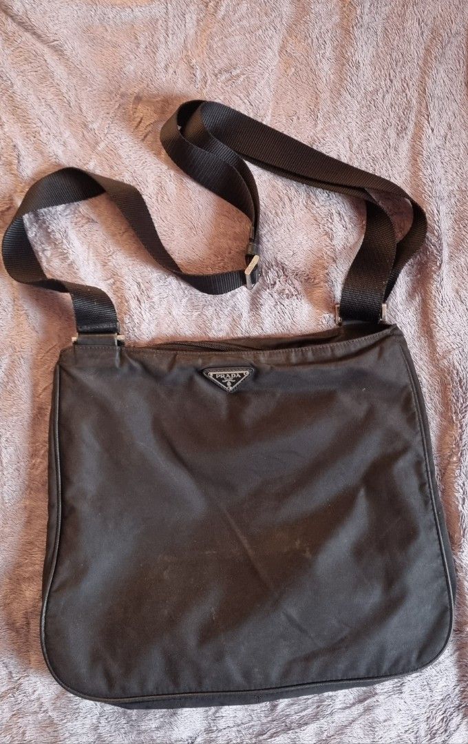 Vintage Prada Tessuto Sling Bag (Category: Luxury Bags & Wallets) located in Talisay. Submitted by parchiracollection (Listing ID 1305595728, Image 1). Description: *With white tag, made in Italy; unmarked zip *it's not faded; it just needed some wash due to dust. *plus SF *Please check detailed pictures before purchasing * This is a second-hand item, kaya wag po mag expect na BAGO *no to low ballers. The discounted price I'll give is the final p