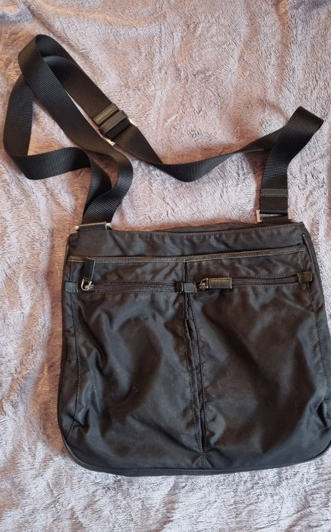 Vintage Prada Tessuto Sling Bag (Category: Luxury Bags & Wallets) located in Talisay. Submitted by parchiracollection (Listing ID 1305595728, Image 2). Description: *With white tag, made in Italy; unmarked zip *it's not faded; it just needed some wash due to dust. *plus SF *Please check detailed pictures before purchasing * This is a second-hand item, kaya wag po mag expect na BAGO *no to low ballers. The discounted price I'll give is the final p