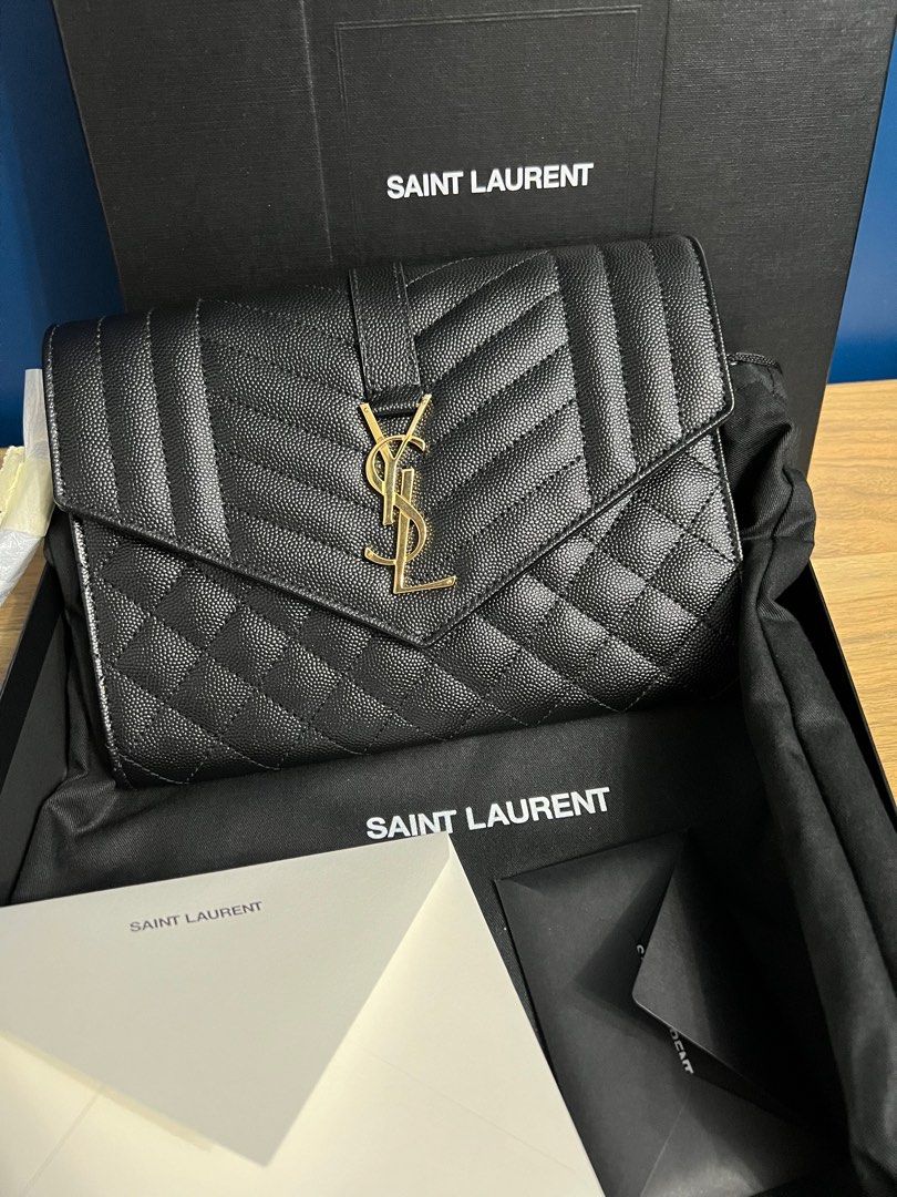 YSL CLUTCH AUTHENTIC BAG (Category: Luxury Bags & Wallets) located in Bacolod City. Submitted by luxepapi (Listing ID 1305599885, Image 3). Description: Retails for ₱50,000 -bought from YSL singapore store/receipt included -complete with box/dustbag/care booklets/receipt.