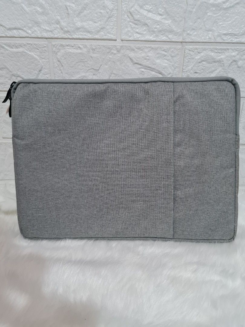 Zippered laptop case (fits 13" laptop) (Category: Laptop Bags & Sleeves) located in Cavite. Submitted by iammil (Listing ID 1305574338, Image 1). Description: Bought at the SM Store for Php 349. No flaw, as good as new. RFS: changed to laptop sleeve.
