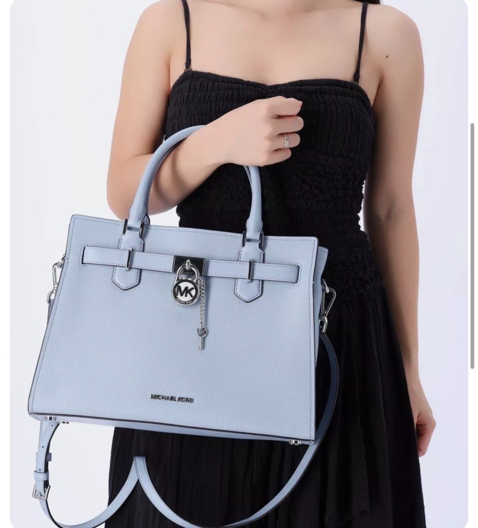 MK Michael Kors Hamilton Medium Guaranted Authentic MONEY BACK Guarantee (Category: Luxury Bags & Wallets) located in Taguig. Submitted by skyjed15 (Listing ID 1305761073, Image 2). Description: MICHAEL KORS HAMILTON MEDIUM SATCHEL COLOR: Pale Blue New with the tag authentic Michael Kors Logo At Front Snap Top Closure Gold Toned Hardware MULBERRY color MK Key & Lock On Front 4 Protective Feet Custom MK Fabric Lining 1 Slip-in Pockets 1 Zipper Poc
