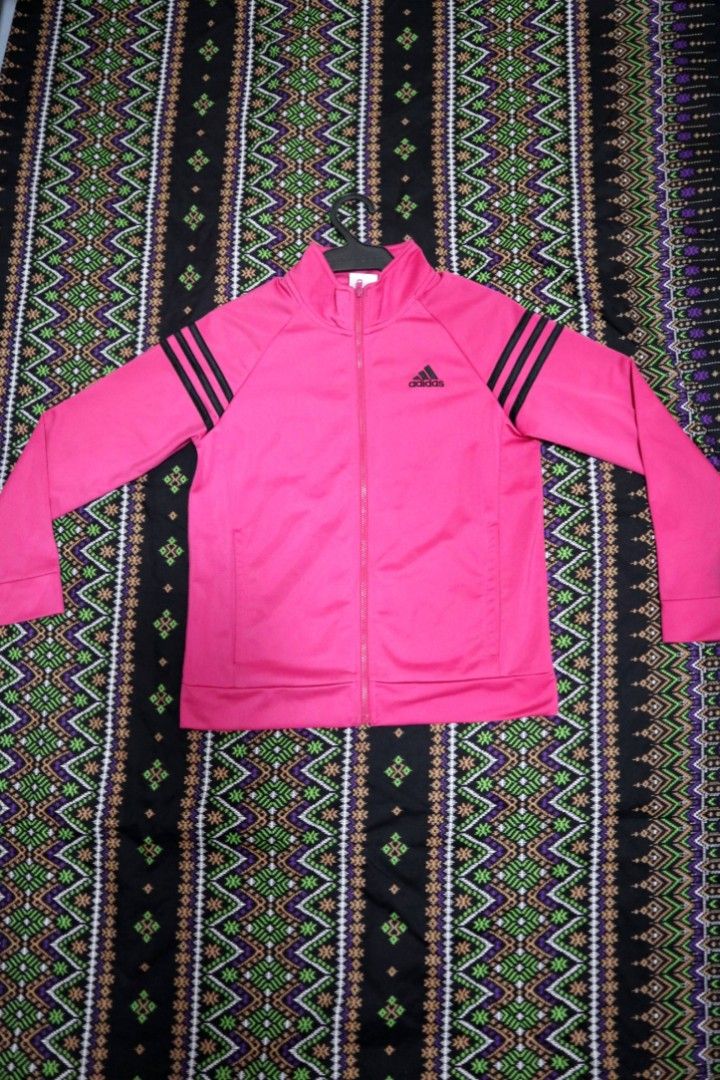 Original Adidas Hot Pink Jacket from US (Category: Babies & Kids Fashion) located in Paranaque City. Submitted by noir.gap (Listing ID 1305768496, Image 1). Description: - Bought from US - Small stain, Barely visible on one sleeve.