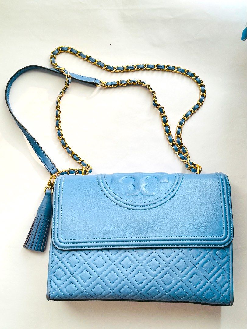 Tory Burch Blue Quilted Leather Fleming Shoulder Bag (Category: Luxury Bags & Wallets) located in Makati City. Submitted by maried05 (Listing ID 1305696055, Image 1). Description: Authentic Tory Burch bought in Manila Price bought Php 25,000 No receipt already With dustbag Lightly used, marks seen in picture Exterior Material-Leather Interior Material-Fabric Length-27 cm Width-8 cm Height-19 cm Shoulder Strap-31 cm shortest 58 Longest Hardware-Go