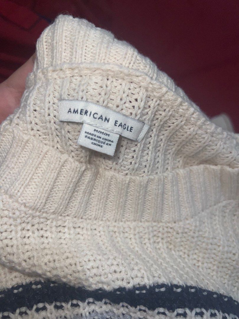 American Eagle White Knitted sweater (Category: Longsleeves) located in Manila. Submitted by _glowkey (Listing ID 1305998713, Image 3). Description: Can fit medium to XL.