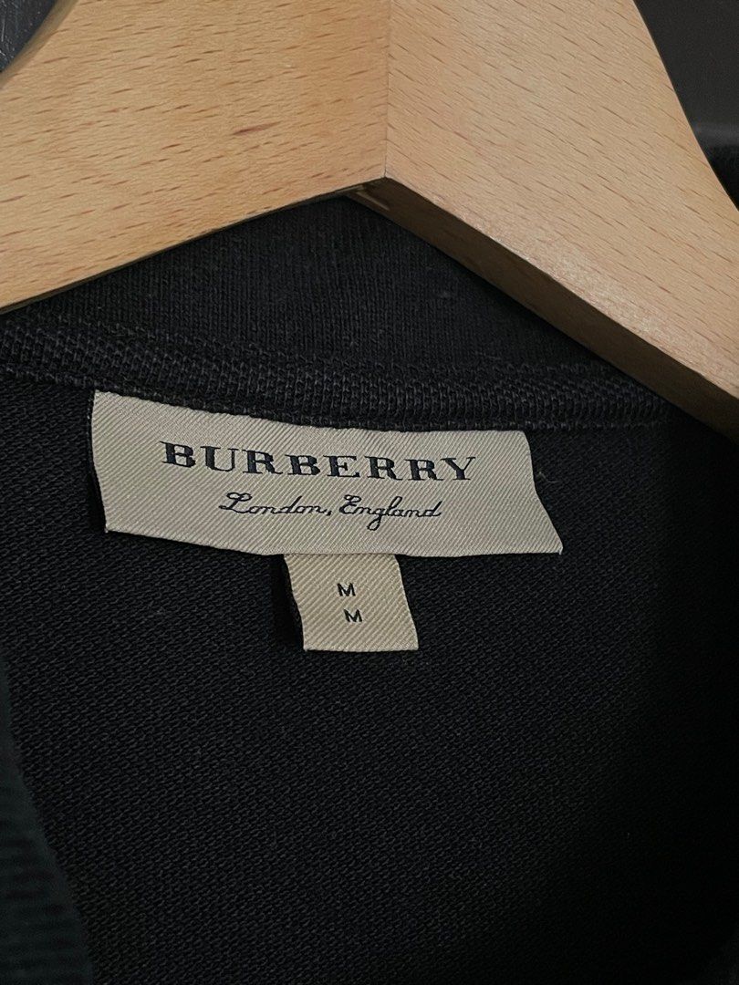 Burberry Black Polo Shirt (Category: Tshirts & Polo Shirts ) located in Dasmarinas. Submitted by matt.declutter (Listing ID 1305915776, Image 3). Description: Burberry Black Polo shirt dimension: 18 x 28 size on tag: Medium.