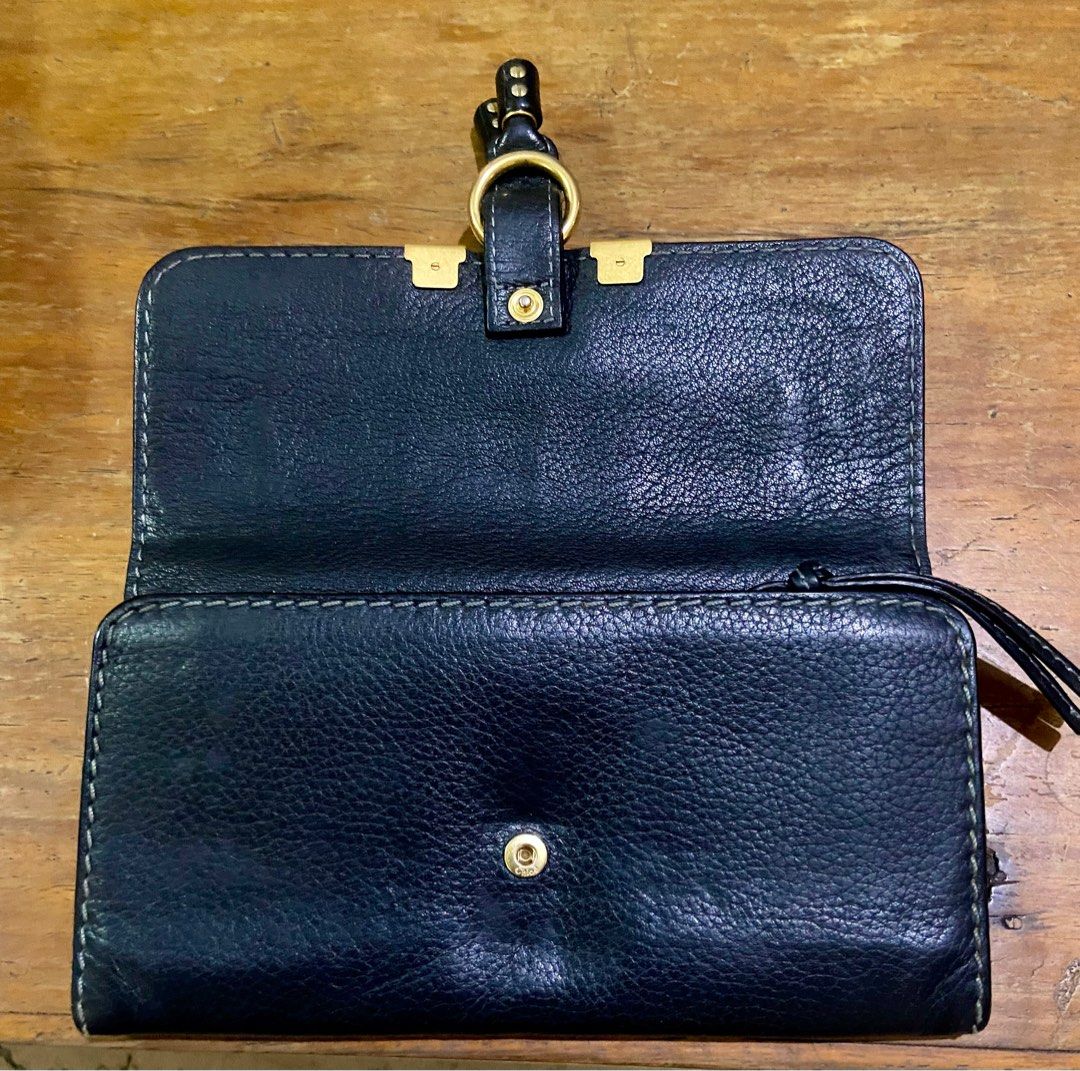 Chloe Marcie Long Flap Wallet (Category: Luxury Bags & Wallets) located in Manila. Submitted by rosamanerds (Listing ID 1301348471, Image 3). Description: Authentic preloved Chloe Marcie long flap wallet color black. Grained leather with gold hardware. In very good condition.With holo sticker. Made in Spain. .