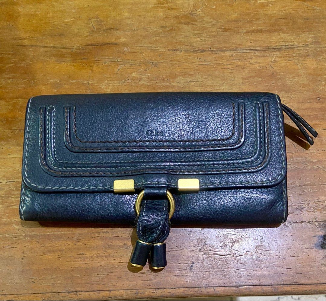 Chloe Marcie Long Flap Wallet (Category: Luxury Bags & Wallets) located in Manila. Submitted by rosamanerds (Listing ID 1301348471, Image 1). Description: Authentic preloved Chloe Marcie long flap wallet color black. Grained leather with gold hardware. In very good condition.With holo sticker. Made in Spain. .