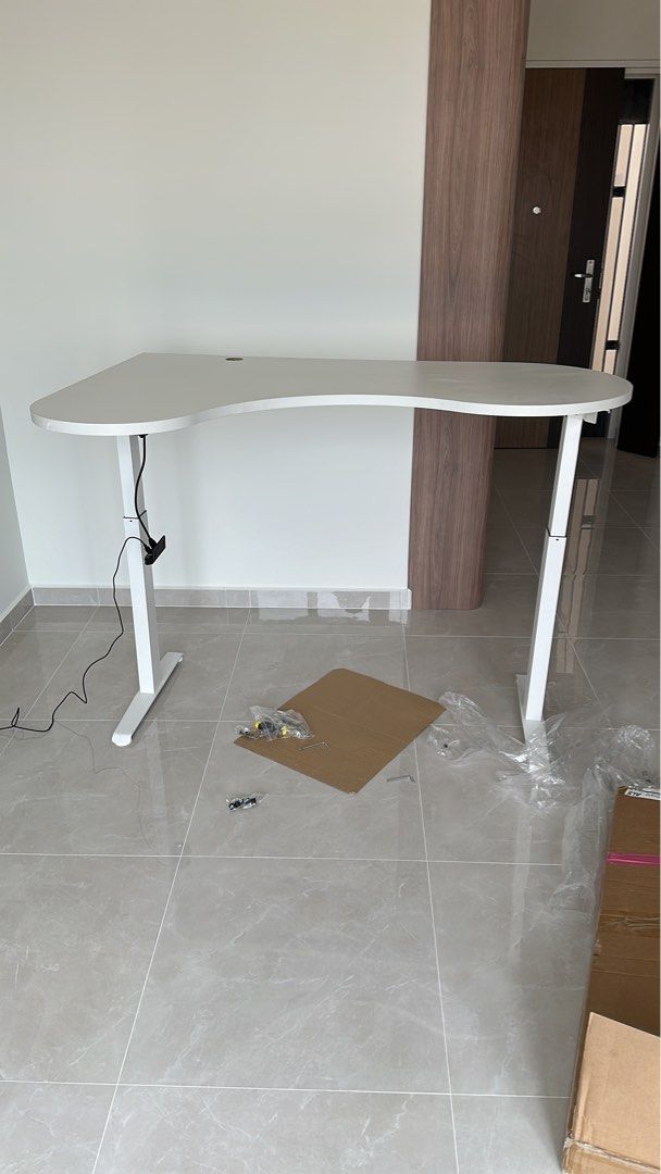 Adjustable computer desk (Category: Tables & Sets) located in Singapore. Submitted by sameer.goodkid (Listing ID 1306016465, Image 2). Description: Auto adjustable tablet up to 110 cm adjustable height. Cool looking highly functional table. Also can customize. Wooden table and metal frame. Need to pre order.