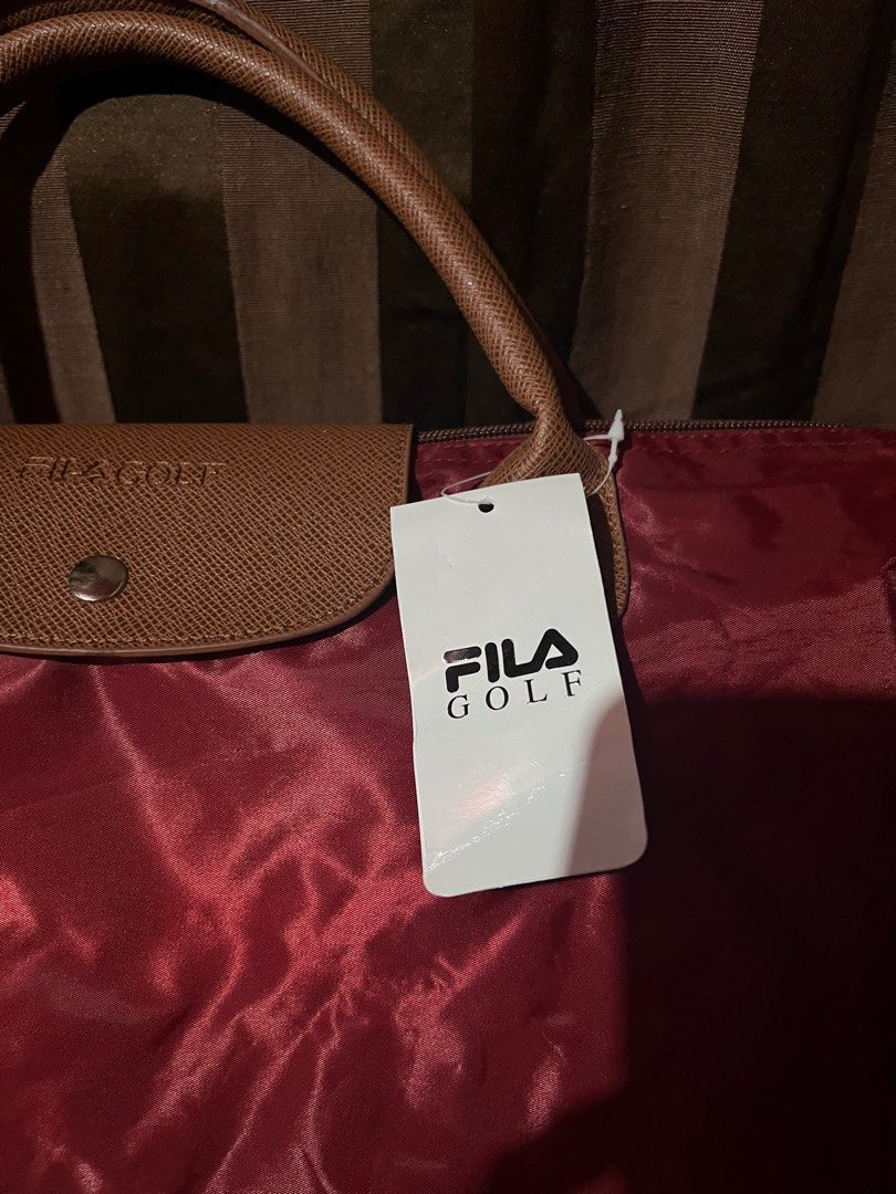 Fila tote bag (Category: Luxury Bags & Wallets) located in Makati City. Submitted by sinner_or_saint101 (Listing ID 1306116953, Image 3). Description: 12x18 x 6 Maroon Never used Fila .