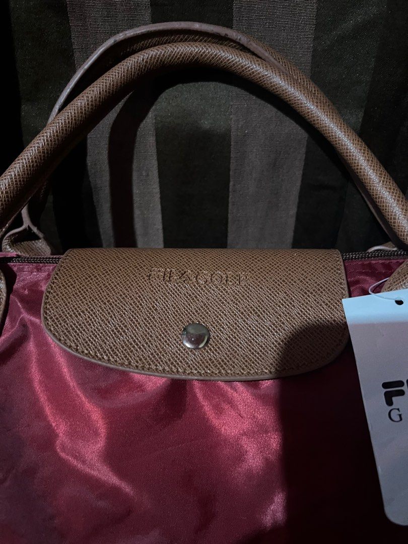 Fila tote bag (Category: Luxury Bags & Wallets) located in Makati City. Submitted by sinner_or_saint101 (Listing ID 1306116953, Image 2). Description: 12x18 x 6 Maroon Never used Fila .