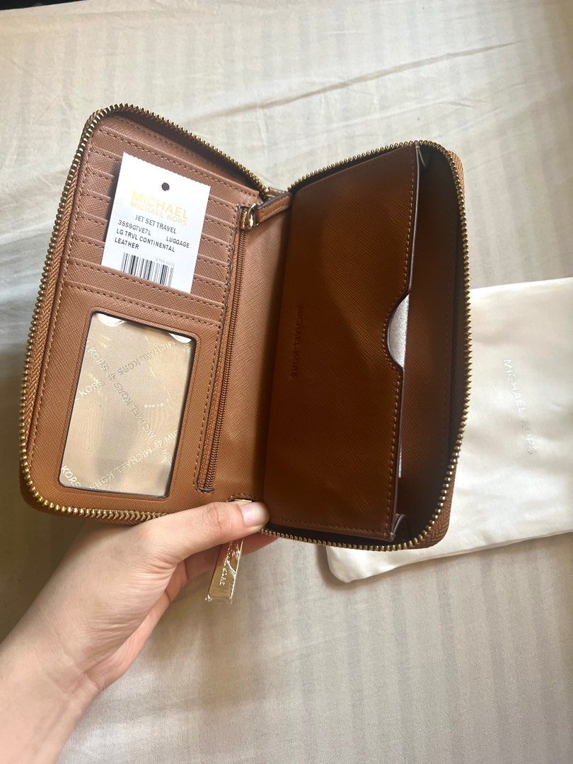 Michael Kors Jet Set Travel Wallet (Brown) (Category: Luxury Bags & Wallets) located in Quezon City. Submitted by jesdlp (Listing ID 1306047723, Image 3). Description: Brand new Medium size wallet with chain RFS: not into big wallets/decluttering Negotiable Let me know if you need more photos..