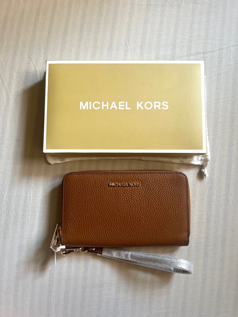 Michael Kors Jet Set Travel Wallet (Brown) (Category: Luxury Bags & Wallets) located in Quezon City. Submitted by jesdlp (Listing ID 1306047723, Image 1). Description: Brand new Medium size wallet with chain RFS: not into big wallets/decluttering Negotiable Let me know if you need more photos..